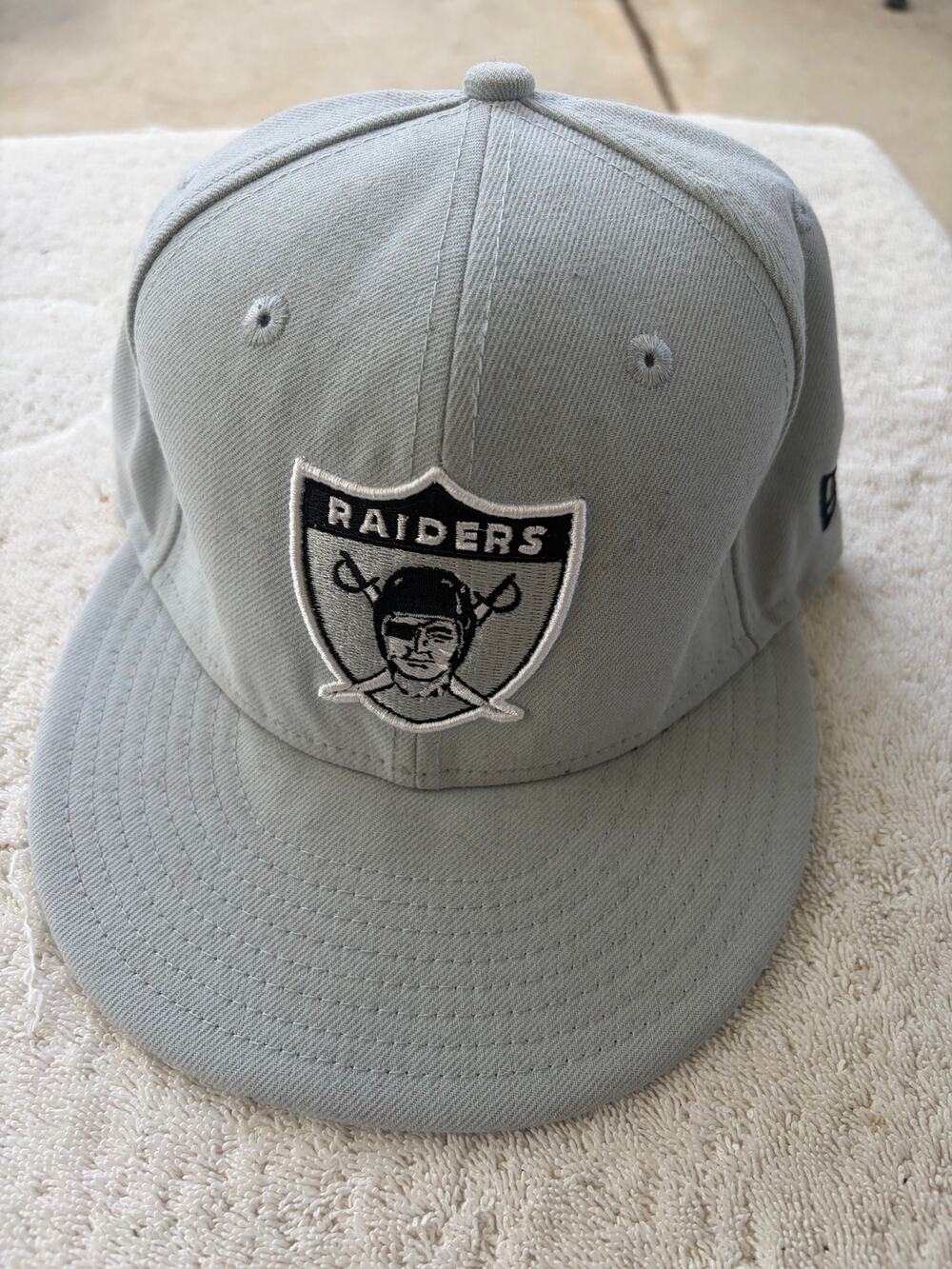 Oakland Raiders fitted hat- size 7 1/4-100% polyester- Preowned